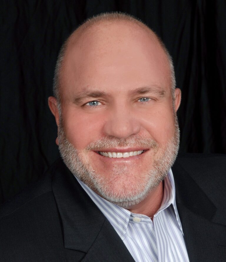 less bald man smiling